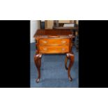 Reproduction Mahogany Side Table with two drawers, supported on claw and ball cabriole legs,