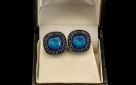 Pair of Vintage Signed Givenchy Clip On Earrings in a square shape with blue stone surrounded by