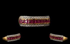 Ruby Half Eternity Ring, a row of closely set, square cut rubies set between two rows of round cut,