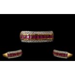 Ruby Half Eternity Ring, a row of closely set, square cut rubies set between two rows of round cut,