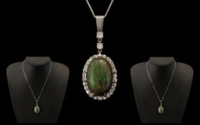 18ct White Gold - Stunning Black Opal and Diamond Set Pendant with Attached 18ct White Gold Chain.