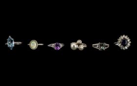 A Collection of Six Silver Dress Rings all set with coloured stones, various sizes.