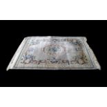 Persian Style Traditional Rug in pale green with floral decoration and central pattern,