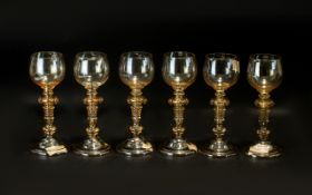 A Set of Eight German Flash Glass Coloured Hoch Glasses with lozenge to the stem and ribbed base.