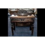 Late Victorian Green Man Carved Oak Side Table with a small shaped back,