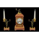 French Clock Garniture. A pink marble and ormolu mounted clock garniture. The case of rectangular