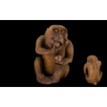 Japanese Meiji Period Carving of a Monkey Eating a Peach, of unusually large size,