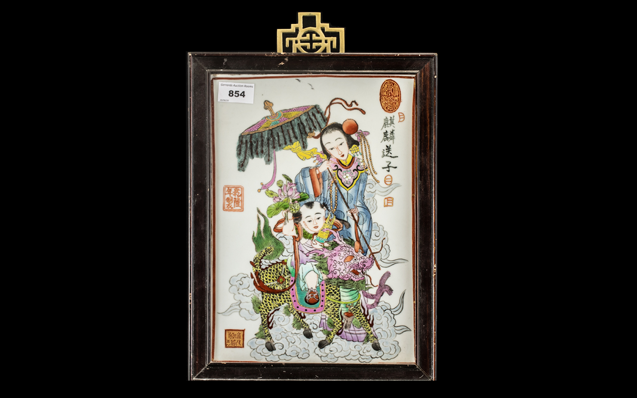 Chinese 20thC Painted Tile Picture depicting a child riding a Kylin with a consort;