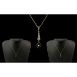 18ct White Gold Diamond Set Elegant and Ornate Pendant Drop attached to a 14ct gold chain,