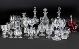 Collection of Cut Glass comprising 5 decanters, various drinking glasses, candlesticks,