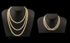 A Set of Three Strand Simulated Pearl Choker, and a long single strand Lotus pearl necklace.