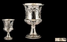 Victorian Period Solid Silver Drinking Vessel with embossed floral decorations to body.