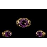 9ct Gold Attractive Single Stone Amethyst Set Ring marked 9ct.