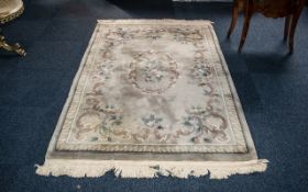 Persian Style Traditional Rug in pale green with floral decoration and central pattern, has some