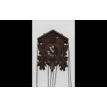 Wooden Swiss Cuckoo Clock with pine cone pendulums. Clock surrounded by wooden birds. As found