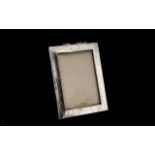 Planished Silver Photo Frame, fully hallmarked for Birmingham 1910; vacant cartouche, wood backed; 7