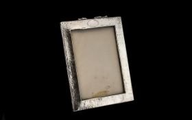 Planished Silver Photo Frame, fully hallmarked for Birmingham 1910; vacant cartouche, wood backed; 7