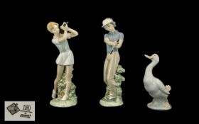Three Nao Figures, comprising a lady golfer 9.5" tall, a gentleman golfer 9.