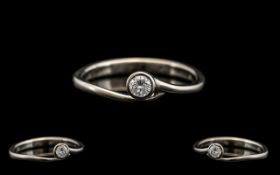 18ct White Gold Ladies Diamond Dress Ring. Twist style with diamond of good sparkle. .10 pts, size