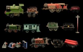 A Collection of Mostly Tin Plate Carriages & Rolling Stock, to include clockwork engines, buffers,