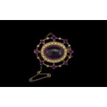 Edwardian Good Quality Amethyst and Seed Pearl Set Ladies Brooch of Oval Form. The Central Large