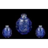 Chinese Blue Cameo Glass Snuff Bottle, carved to the body with dragons and phoenix birds,