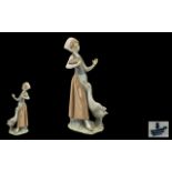 Lladro Handpainted Porcelain Figure ' Girl with Duck' Model No. 1052. Issued 1969 - 1998.