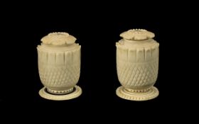 Pair of Anglo Indian Carved Ivory Pepperettes, c1860s, with screw petal shaped lids,