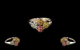 Yellow, Orange, Sunset and Green Sapphire Ring, four flower heads, one in each of the fancy sapphire