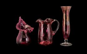 Cranberry Glass - 3 Pieces, comprising: Jug with dimple impression, measures 6'' tall; Bud Vase with