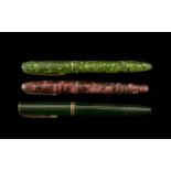 Collection of Three Parker Pens comprising a pink marbled effect Parker pen with 14ct gold nib;