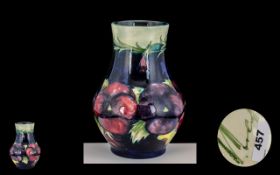 William Moorcroft Signed Bulbous 'Pansy' Pattern Vase of pleasing proportions, c1920s, 7 inches (17.