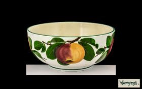 Wemyss Large Circular Footed Fruit Bowl in 'Apples and Leaves' pattern on a white ground,