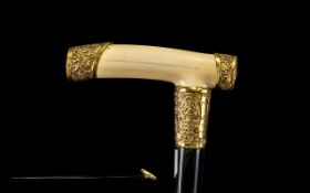 Victorian Ebonised Walking Stick with an ivory handle grip,