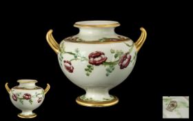 William Moorcroft Signed James Macintyre Twin Handled 'Rose Garland' Design Vase, on white ground,