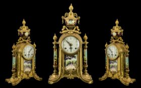 A French Empire-Style Mantle Clock with brass case with painted supports and urn finial.