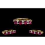 18ct Gold Attractive Ruby & Diamond Set Dress Ring. The four rubies with six diamond spacers.