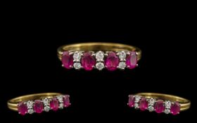 18ct Gold Attractive Ruby & Diamond Set Dress Ring. The four rubies with six diamond spacers.