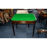 Late Georgian Mahogany Green Beige Card Table with a fold over top and supported on turned legs,