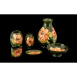 Collection of Moorcroft Hibiscus Pottery, six pieces in total,