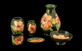 Collection of Moorcroft Hibiscus Pottery, six pieces in total,