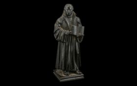 German Antique Bronzed Iron Figure of Luther holding a book,