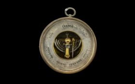 A 19thC Scottish Barometer with silvered dial and a 5 1/2" brass case. Dial marked for Gardner & Co.