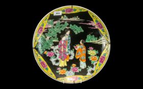 Japanese Charger with Black Enamel Body Colour with a scene of elegant female figures in a