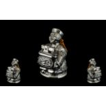 Unusual 1930s Chromed Metal Petrol Cigarette Lighter in the form of a seated Chinese Mandarin,