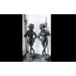Pair of Large Cast Iron Garden Figures of Florentine Soldiers or Bodyguards in traditional garb of