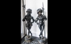 Pair of Large Cast Iron Garden Figures of Florentine Soldiers or Bodyguards in traditional garb of