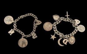 Two Silver Charm Bracelets with various medallions and trinkets attached,