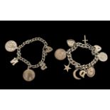 Two Silver Charm Bracelets with various medallions and trinkets attached,