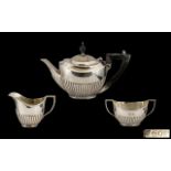 Edwardian Period Silver Three-Piece Bachelor Tea Service of small proportions.